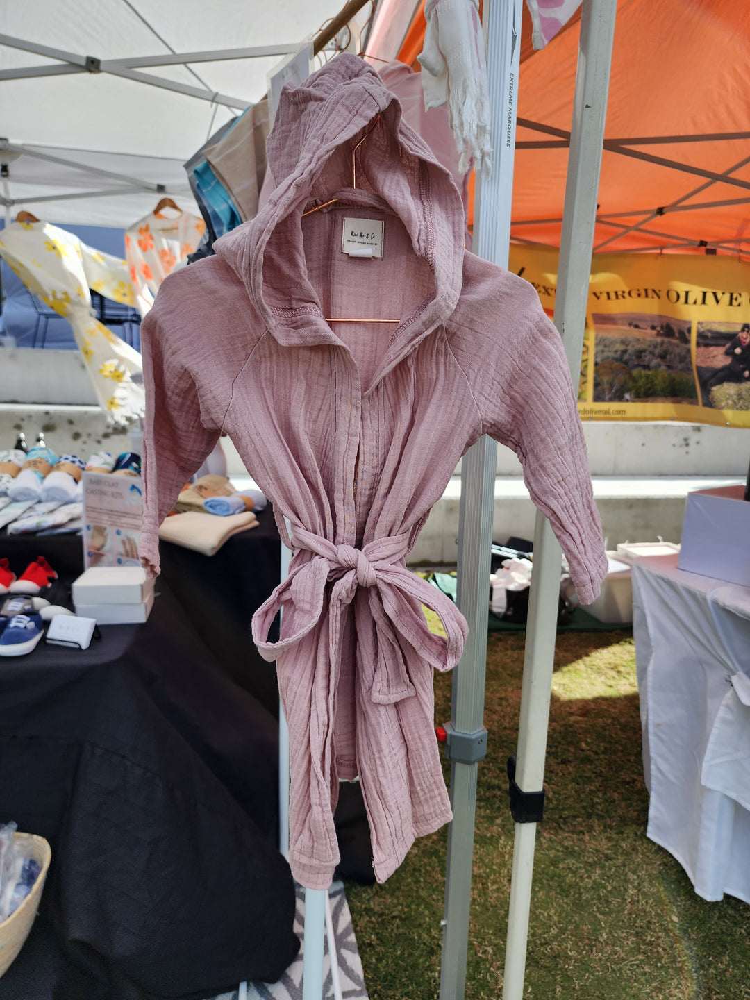 Soft and absorbent powder pink kids robe made from 100% organic Turkish cotton, perfect for after bath or swim time.