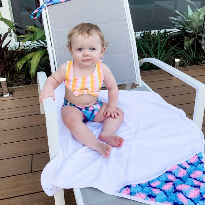 Eco-Friendly Feather Swim Nappy: Mini Me & Co reusable swim nappy showcasing a chic feather motif, crafted from breathable and waterproof materials.