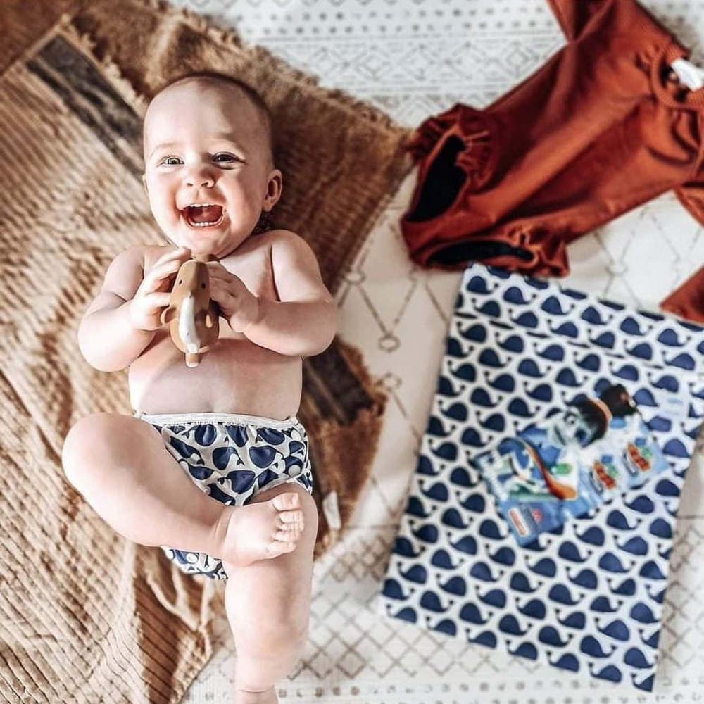 Eco-friendly whale-patterned swim nappy by Mini Me & Co, designed for comfort and leak protection in the pool.